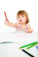 Little baby girl draws pencil