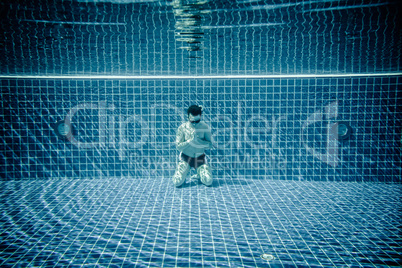 Man praying under water pool