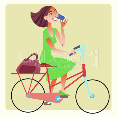 Young woman riding a bike and talking on the smartphone