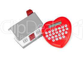 Calculator heart shaped and miniature house.
