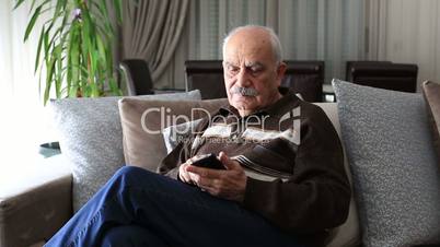 Senior Man using smartphone