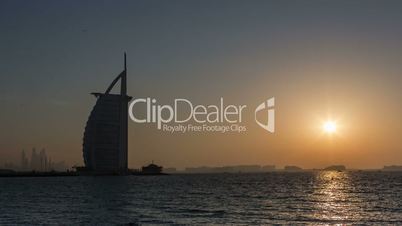 Time Lapse Photography Burj Al Arab at sunset