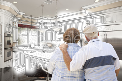 Senior Couple Looking Over Custom Kitchen Design Drawing and Pho