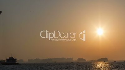 Time Lapse Photography Burj Al Arab at sunset