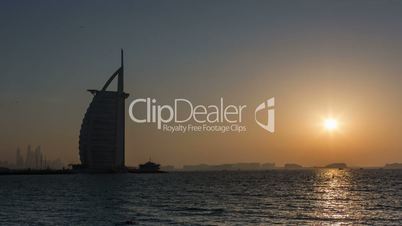Time Lapse Photography Burj Al Arab at sunset