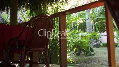 Cafe interior with empty tables on tropical resort