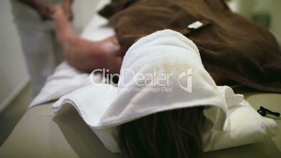 Massage therapist working at beauty spa