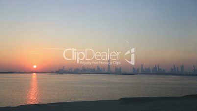 time lapse view of Dubai skyscraper and Burj Khalifa at sunset