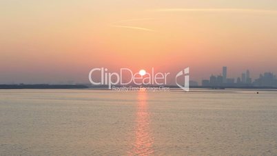 view of Dubai skyscraper and Burj Khalifa at sunset