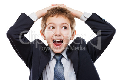 Amazed or surprised child boy in business suit holding hairs on