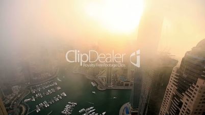 time lapse aerial view skyscraper foggy weather Dubai Marina
