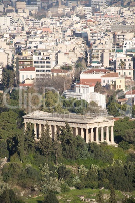 Temple of Hephaistos in park beside suburbs