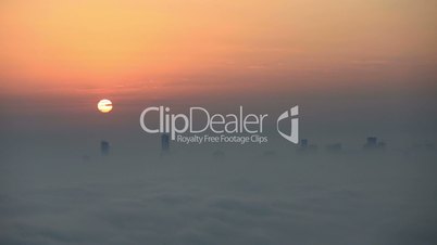 time lapse aerial view foggy weather Dubai Marina at sunrise