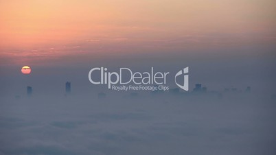 time lapse aerial view foggy weather Dubai Marina at sunrise