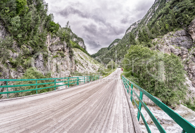 Wooden bridge through the Alps