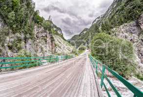 Wooden bridge through the Alps