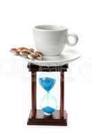 hourglass and a cup of coffee