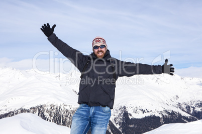 Guy is happy to be in the snowy mountains