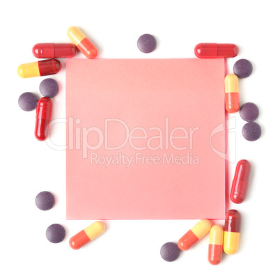 Colorful pills and paper for notes