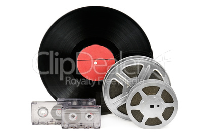 audio cassettes, records and film strip isolated on white backgr