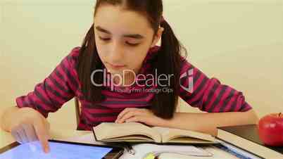 Schoolgirl studying with tablet pc