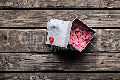 Open gift box with hearts
