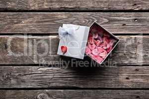 Open gift box with hearts
