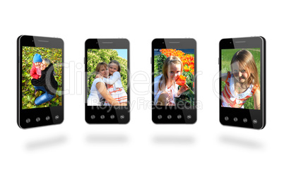 four smart-phones with colored images isolated on the white