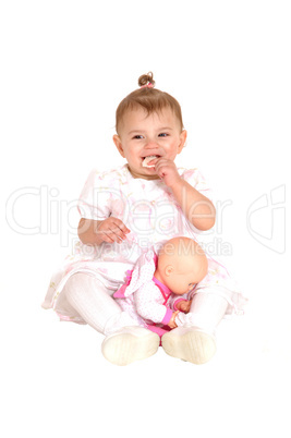 Baby girl sitting on floor.