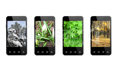 four smart-phones with colored images of seasons