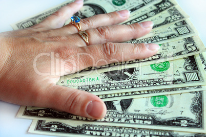 Hand holding US dollars isolated on a white background
