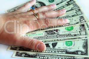 Hand holding US dollars isolated on a white background