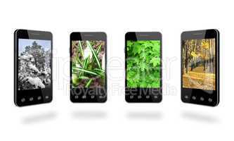 four smart-phones with colored images of seasons