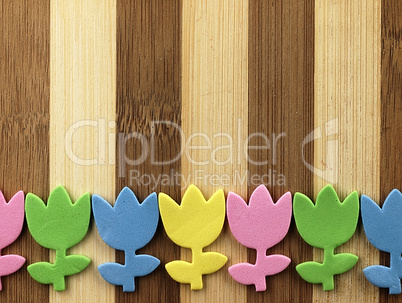 Colorful cut tulips on a chopping board.