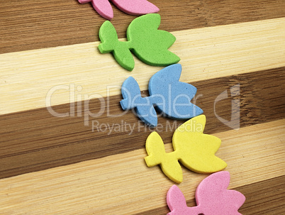 Colorful cut tulips on a chopping board.