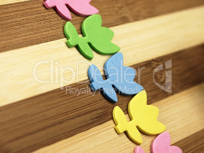 Colorful cut tulips on a chopping board.