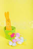 Easter Bunny in bucket on yellow