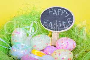 Ester eggs in nest with small chalkboard