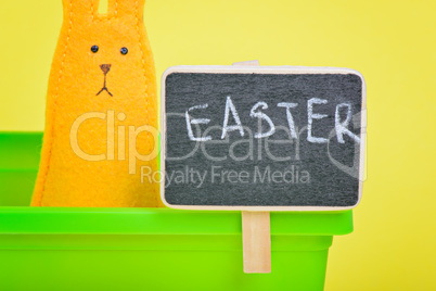 Easter Bunny in flower pot with blackboard
