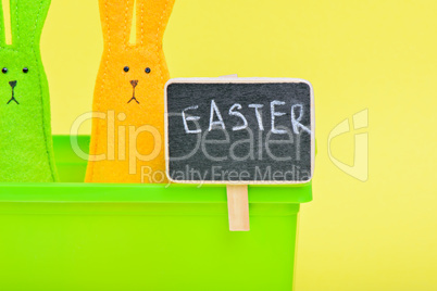 Easter Bunnies in flower pot with black board