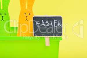 Easter Bunnies in flower pot with black board