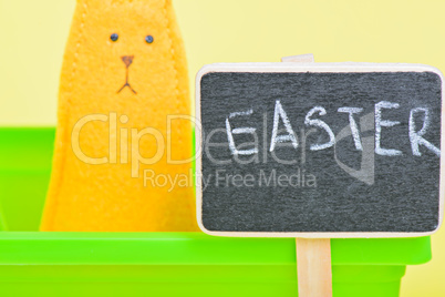Blackboard with easter bunny on the background