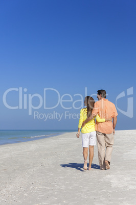 Couple Walking on An Empty Beach