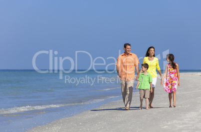 Mother Father and Children Family Walking On Beach