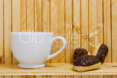 Mini Eclairs with a cup of tea