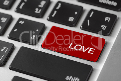 computer notebook keyboard selected focus on  red enter button w