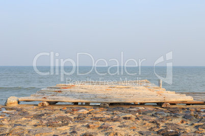 wooden pier to the sea and sky