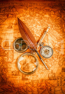 Vintage magnifying glass lies on an ancient world map