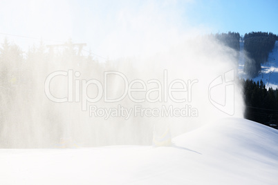 The slope of Bukovel ski resort with working snow machine, Ukrai