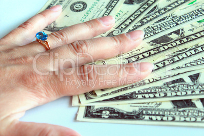 woman's hand purchasing the ring with topaz